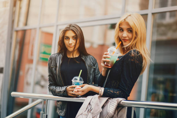 istock girls with cocktail 1143688197
