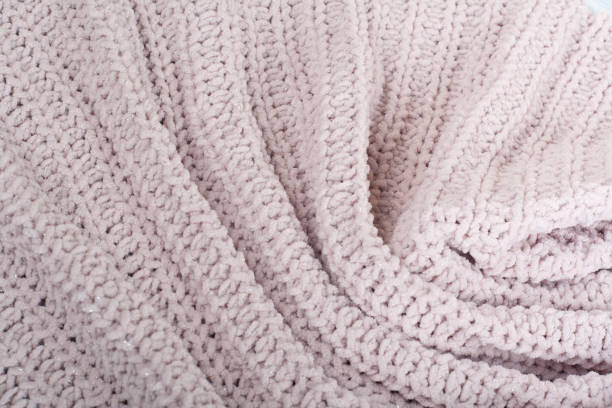 istock Sweater or scarf fabric texture large knitting. Knitted jersey background with a relief pattern. Wool hand- machine, handmade. 1143688319