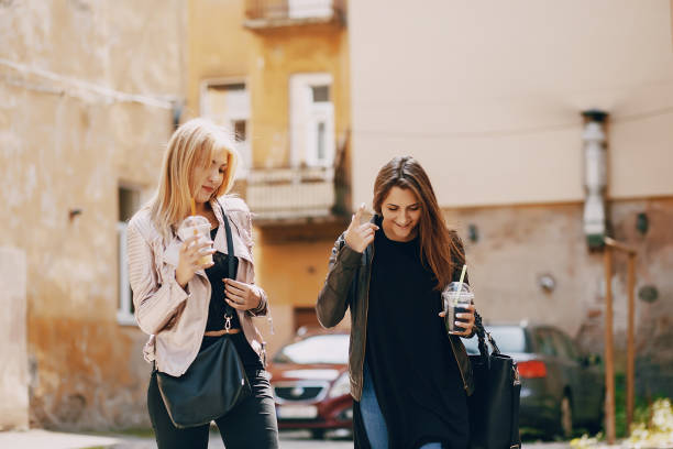 istock girls with cocktail 1143688577