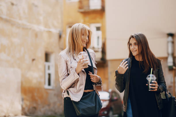 istock girls with cocktail 1143688632