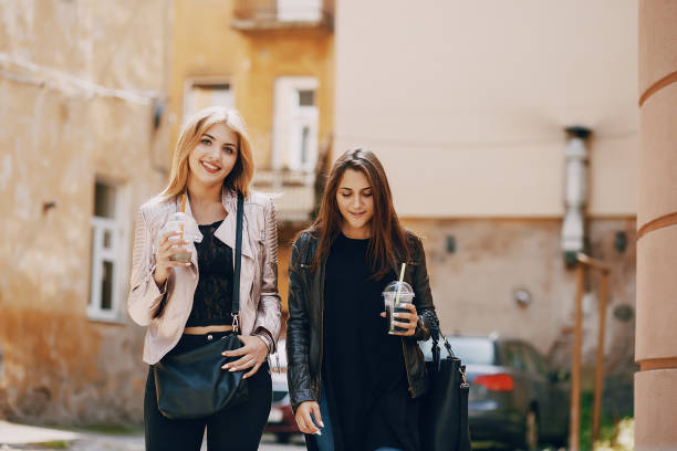 istock girls with cocktail 1143688668