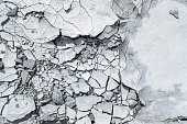 Grey pattern or textured background with cracked concrete.