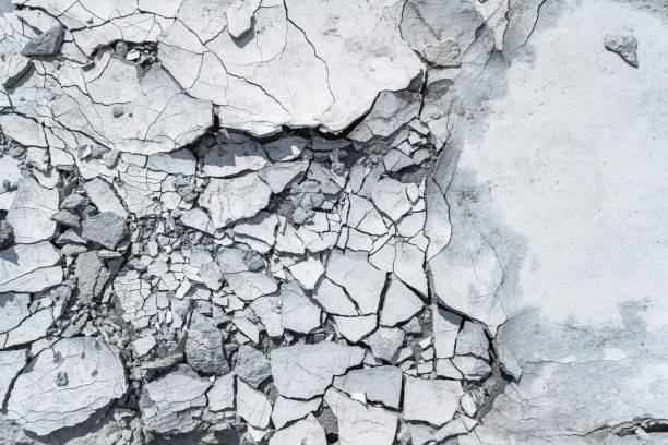 grey pattern or textured background with cracked concrete. - cracked imagens e fotografias de stock
