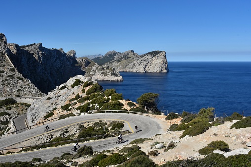 Cap Formentor, Mallorca, Spain - April 5, 2019 - in the background unidentified cyclist