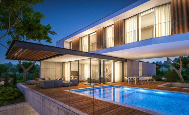 istock 3d rendering of modern house on the hill with pool in night 1143691297