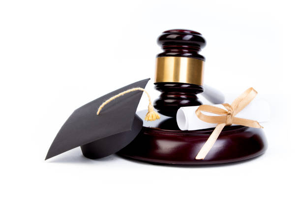 istock Graduation Hat with Diploma,Judge gavel on white background. 1143693787
