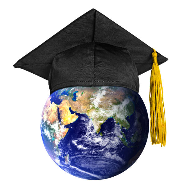 Global education concept - mortarboard on Earth globe (isolated on white). stock photo