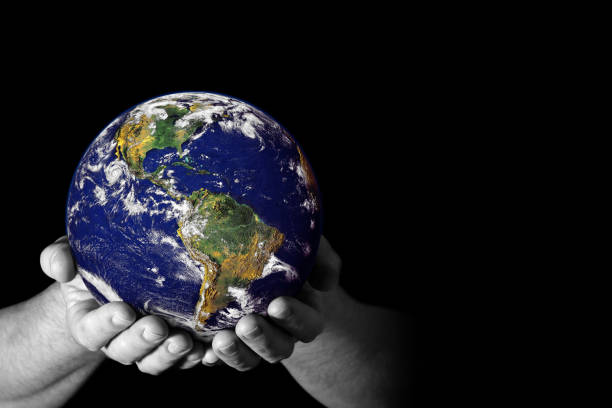 istock Hands holding the Earth with North America visible 1143694946
