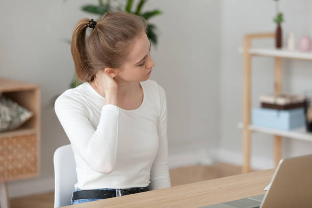 istock Tired woman feeling pain after sedentary computer work, massaging neck 1143696612