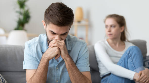 istock Upset frustrated man ignoring woman sitting behind, thinking 1143696714