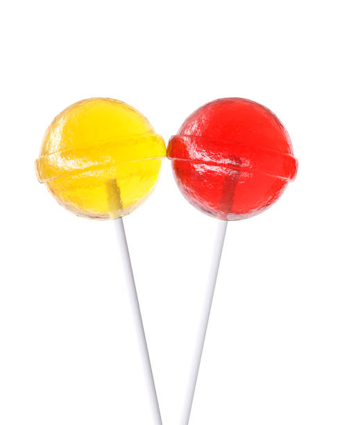istock Red and yellow lollipops isolated on white background 1143700622