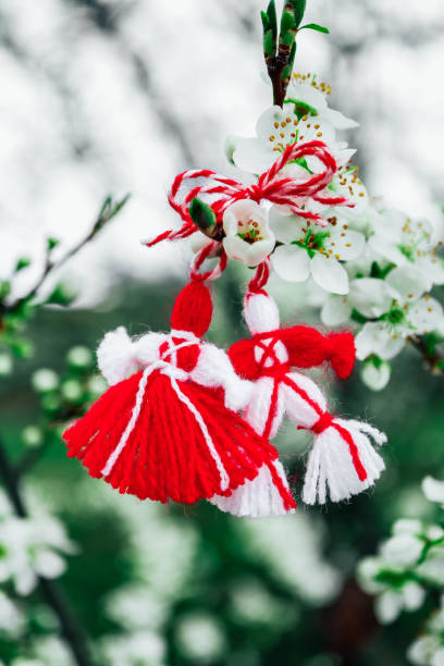 istock Bulgarian traditional spring decor martenitsa on the blossom tree background. Baba Marta holiday. 1143701006
