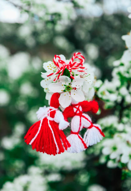 istock Bulgarian traditional spring decor martenitsa on the blossom tree background. Baba Marta holiday. 1143701017