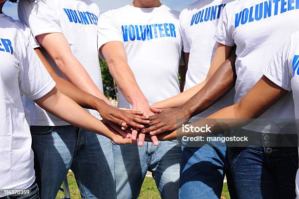 Multiethnic Volunteer Group Hands Together Stock Photo - Download Image Now - Volunteer, Group Of People, Community