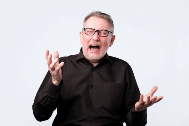 istock Angry shocked man screaming, isolated on white background. 1143704062