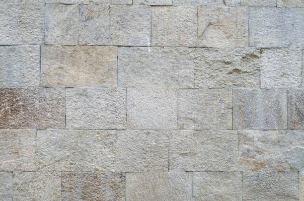 istock New polished sliced stone cladding on wall closeup 1143705563