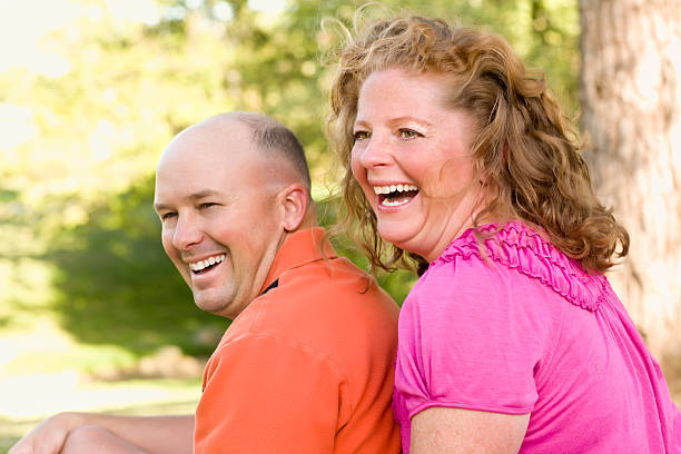 istock Happy Attractive Couple Laughing in Park 114370586