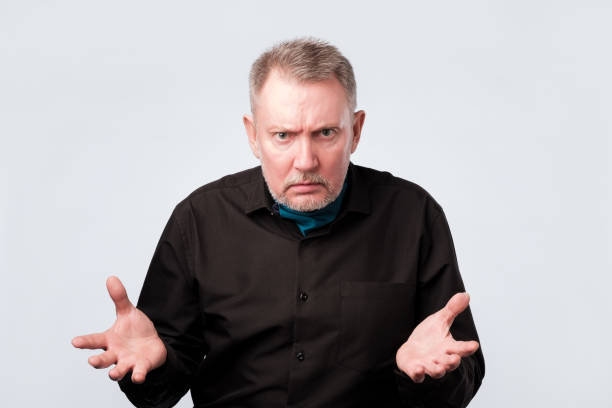 istock Senior man talking to his coworker. He is discussing important problem 1143706940