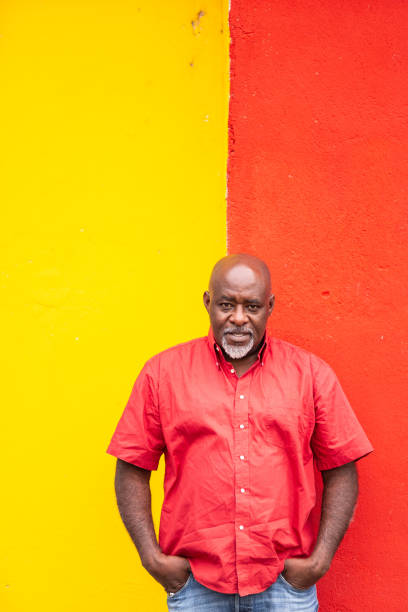 istock Mature afro man portrait on colorful background 1143707416