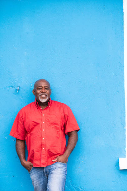 Mature afro man portrait on blue background