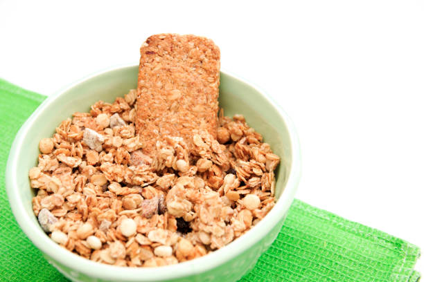 crispy muesli dry Breakfast in a bowl isolated on white background selective focus, top view.