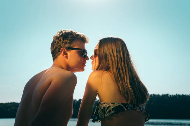 istock Couple cuddling at the beach 1143713984