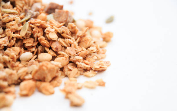 istock Crispy muesli dry Breakfast isolated on white background selective focus, top view 1143714160