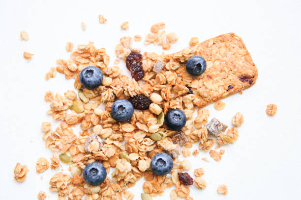 istock Crunchy muesli and blueberry Breakfast cereals isolated on white background, selective focus, top view 1143714913