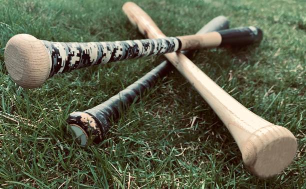 istock Wood baseball bats on grass 1143715745
