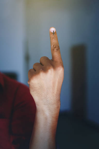 istock Indian Voter Hand with voting sign 1143716384