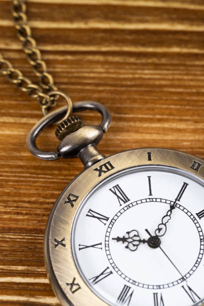 istock Vintage pocket watch clock on wooden background 1143717228