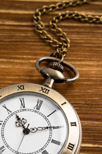 istock Vintage pocket watch clock on wooden background 1143717617