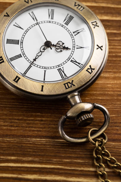 istock Vintage pocket watch clock on wooden background 1143717618