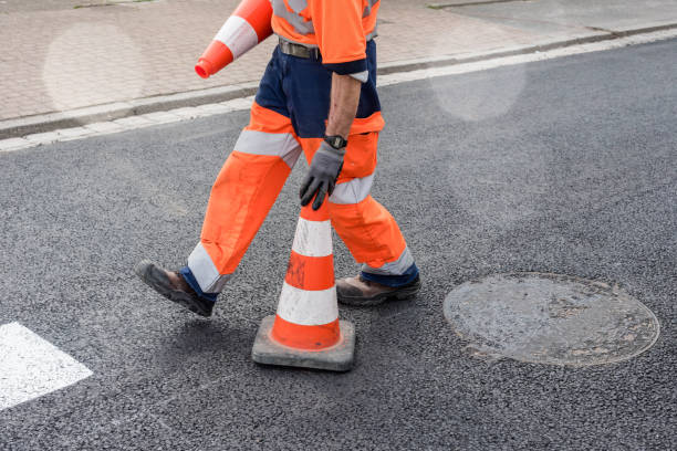 worker making the passages for pedestrian worker at work on the road traffic cone photos stock pictures, royalty-free photos & images