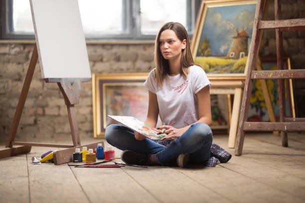 istock Beautiful female artist posing 1143719141