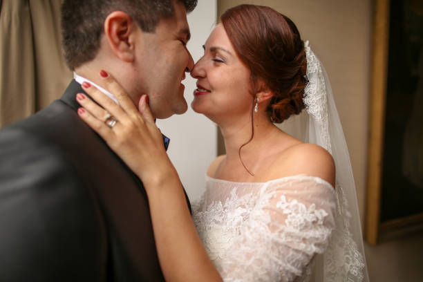 istock Beautiful romantic wedding couple posing in hotel room 1143719222