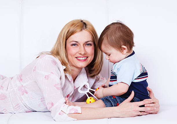 istock Woman embracing son 114372072