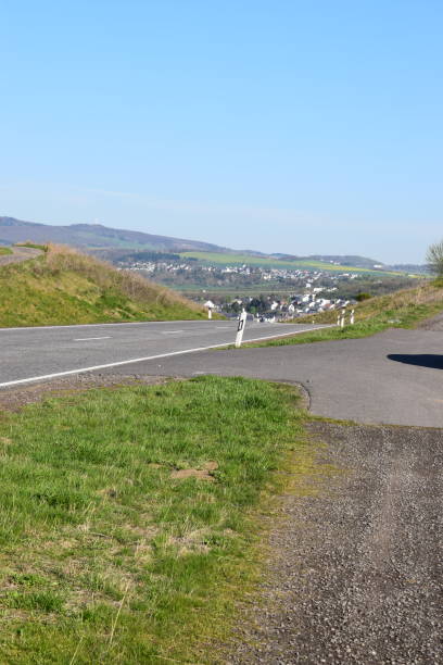 istock country road in spring, green Eifel hills 1143722104