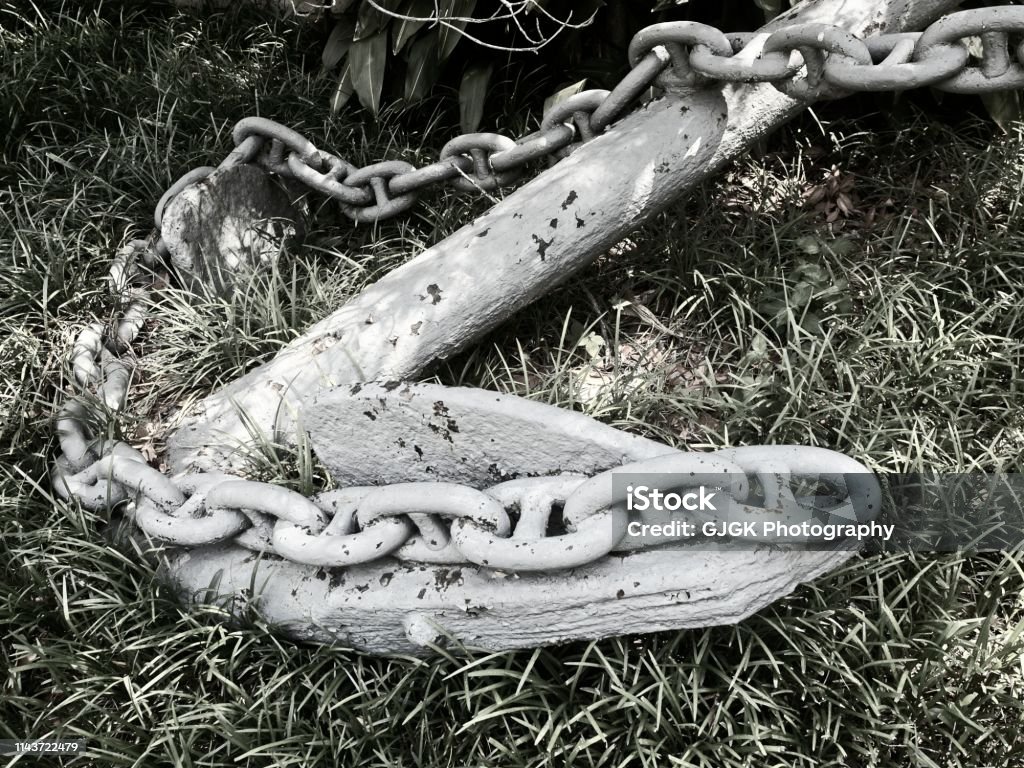 Ship Anchor in the Green Grass B&W New Orleans, LA USA - 05/09/2018  -  Ship Anchor in the Green Grass in B&W Tulane University Stock Photo