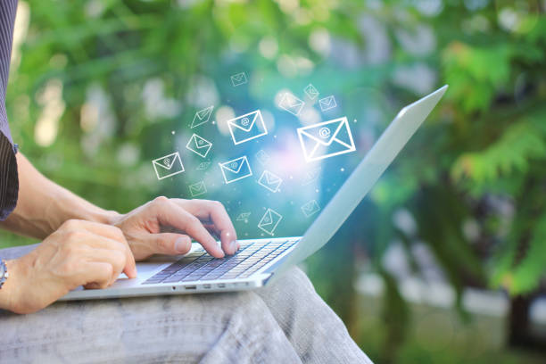istock Business man using laptop computer for checking emai with icon or hologram in home office 1143723808