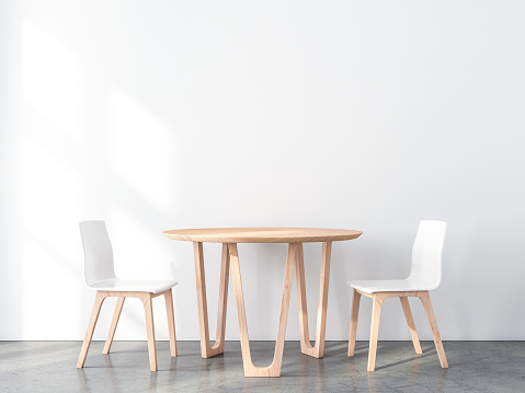 Two wooden chairs with table in modern interior with white wall and concrete floor. 3d rendering