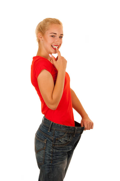 istock active young woman gesture weight loss isolated over white background 1143724593