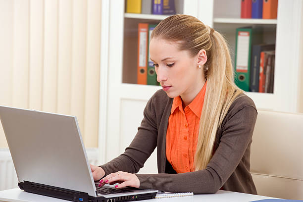 istock woman working on laptop 114372462