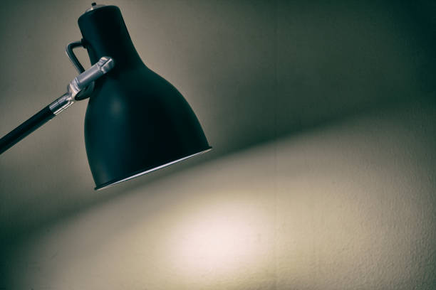 istock Black fixture lamp with white  wall background 1143725169