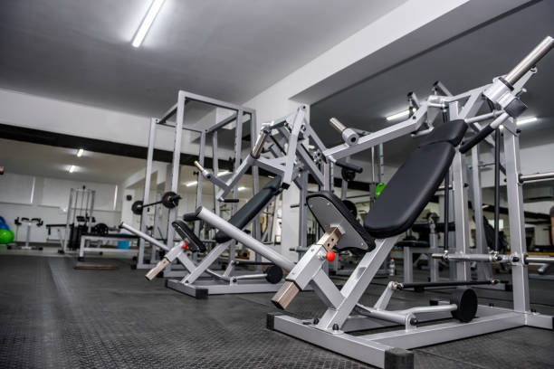 istock Modern interior of light gym with different equipment 1143727159