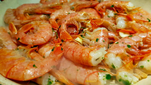 Grilled prawns marinated in garlic and parsley stock photo