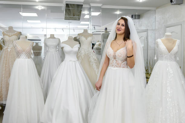 istock Attractive young bride in wedding dress in modern salon 1143728604