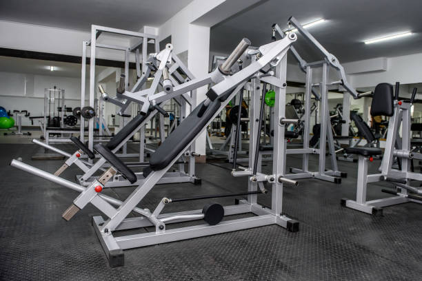 istock Modern interior of light gym with different equipment 1143728642