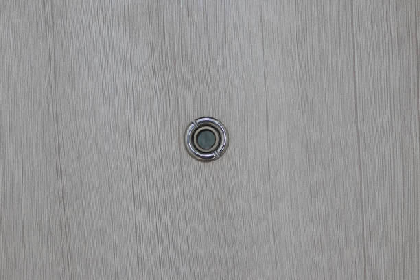 istock Peephole on wooden door. 1143730006