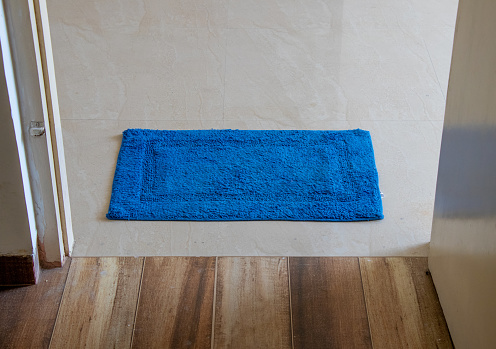Blue door  mat lying in door
